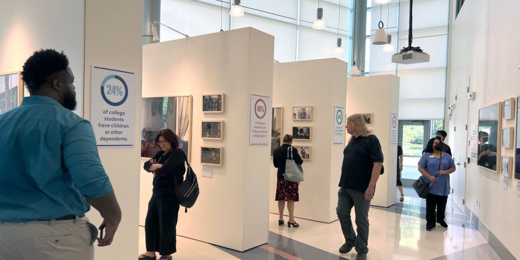 A shot of visitors looking at the Lumina art exhibit.